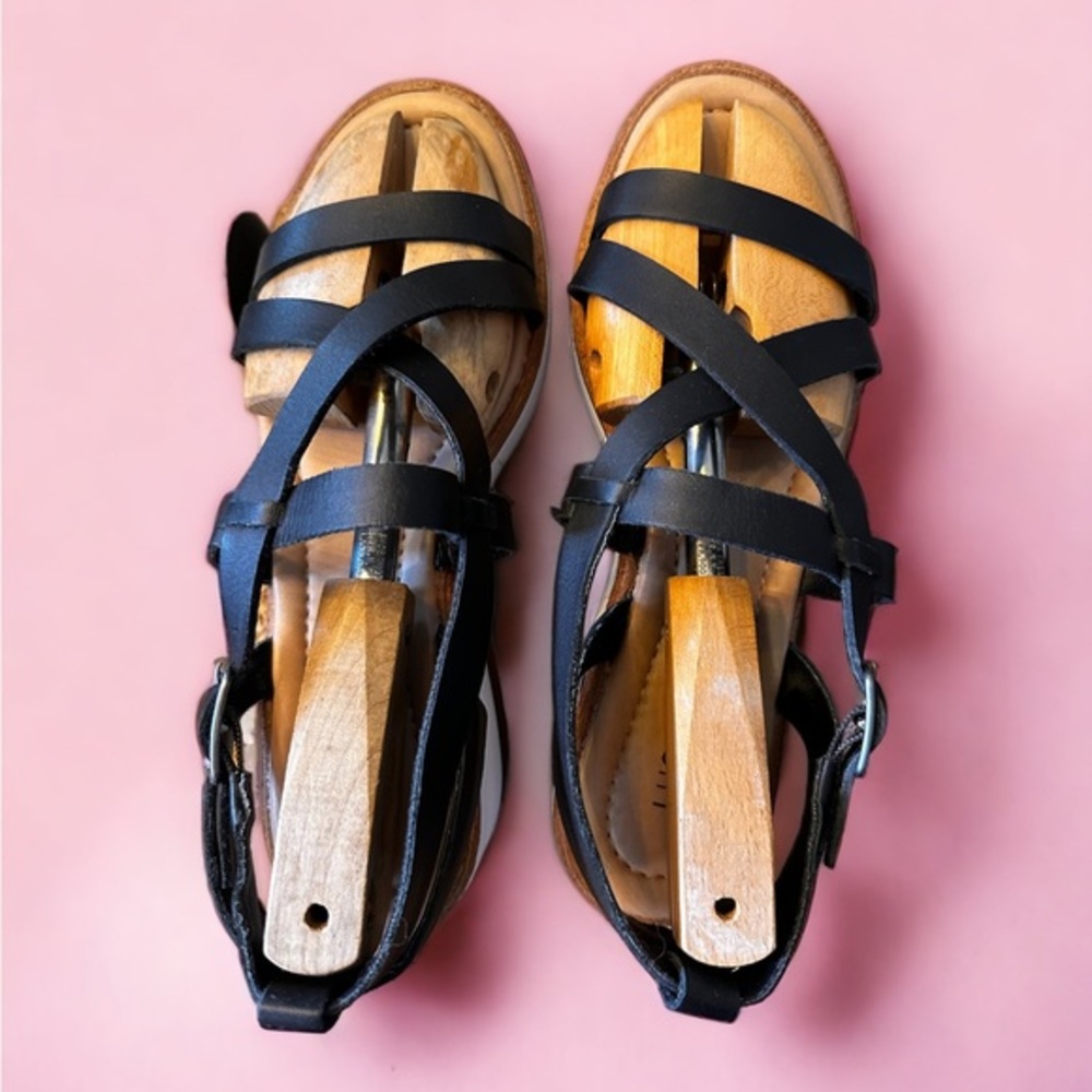 Lucky Brand black w white and natural soles , leather straps closure